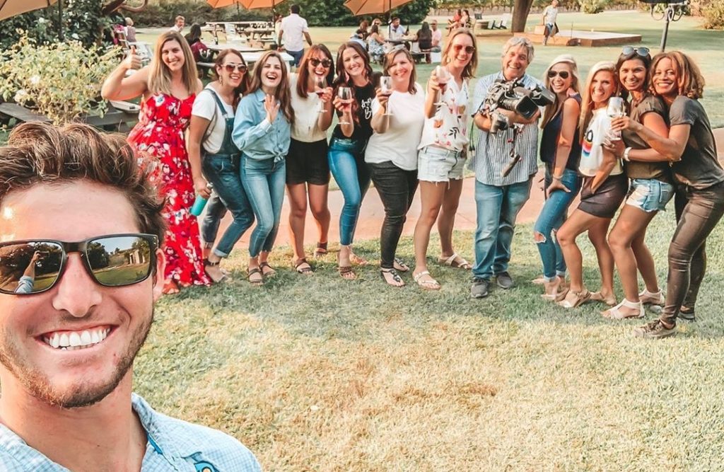 Tomeka Jones with group wine tasting after biking portion of tour. 
