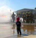 boy watching firemen
