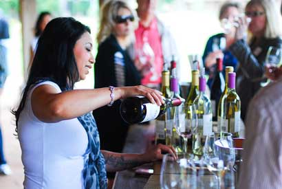 pouring a glass of wine on a tour